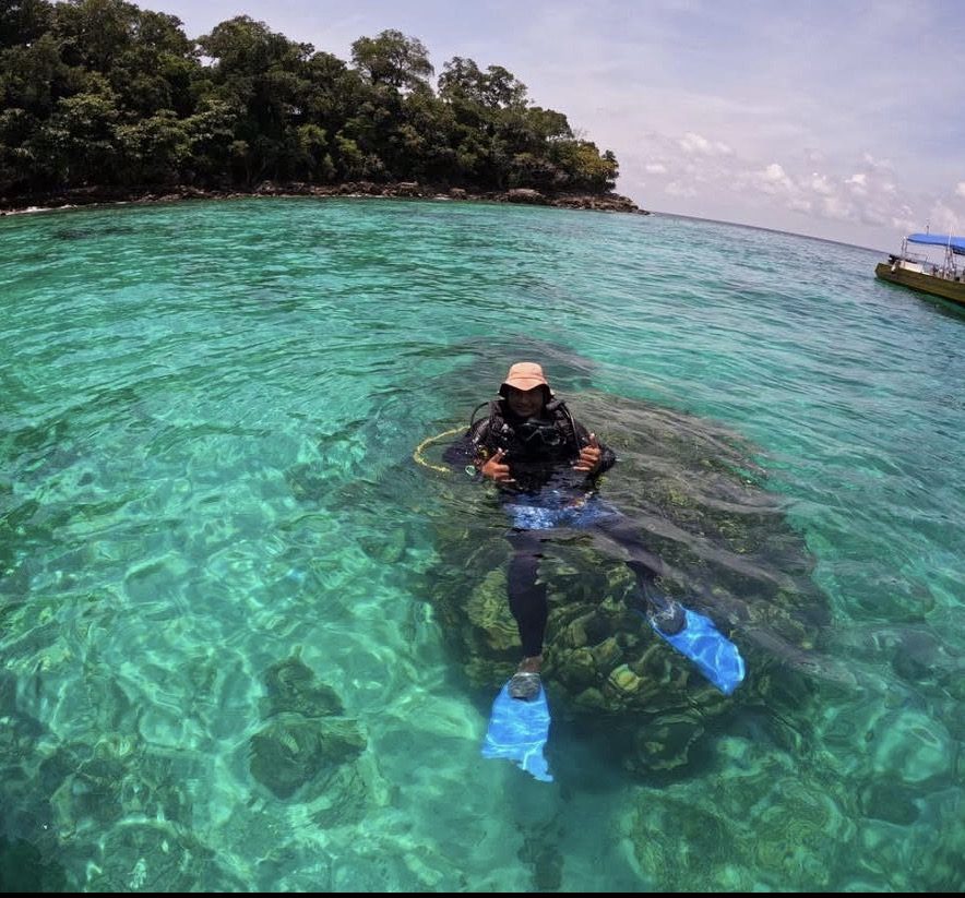 Local Langkawi snorkeling guide briefing tourists on marine park rules
