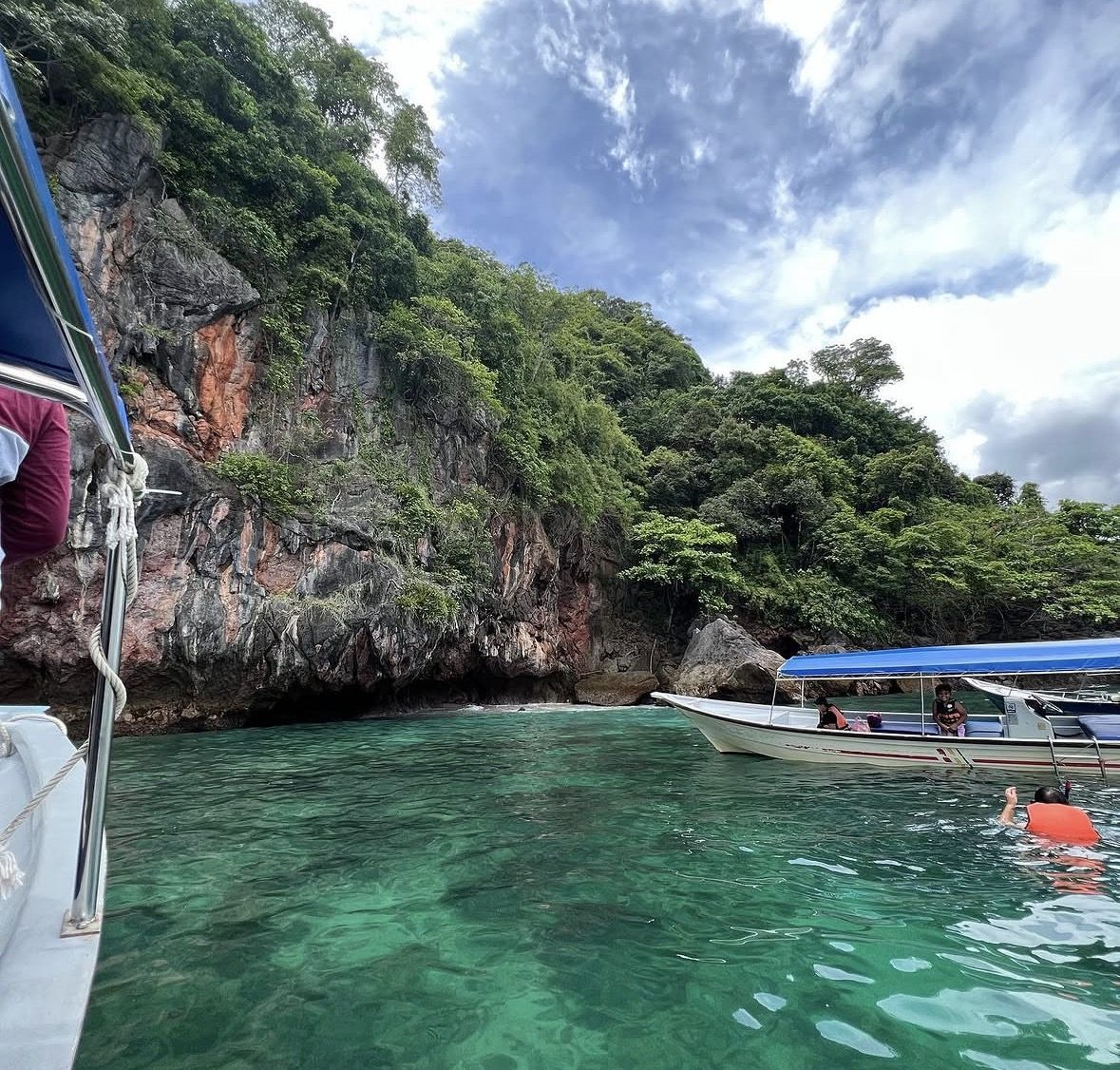 Safety briefing on board a snorkeling Langkawi tour boat with life jackets
